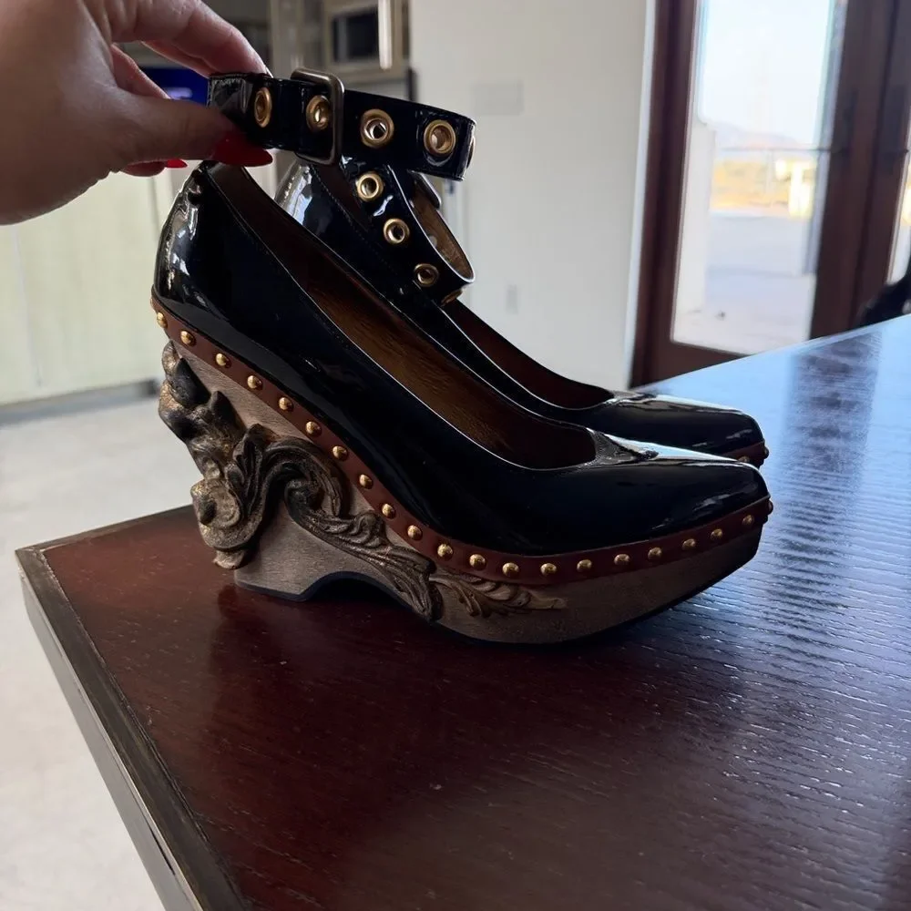 Miu Miu Black Heels with Sculpted Gold Accents